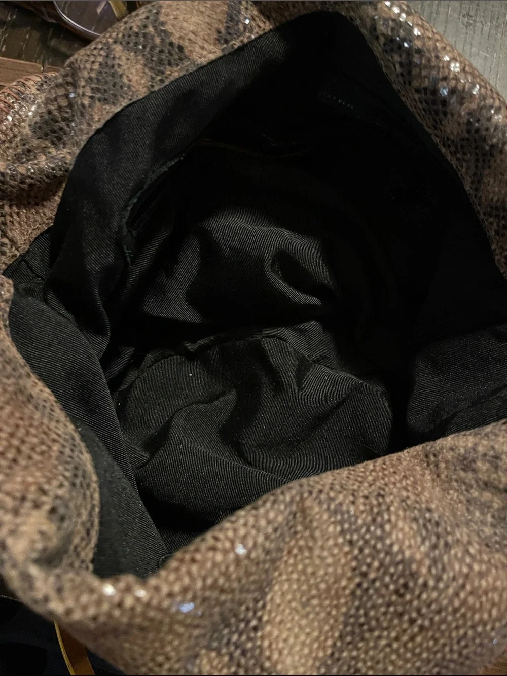 Black Hobo Bag with Brown Braided Strap and Tassel